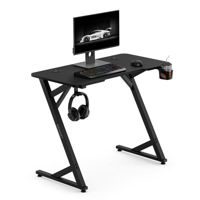 Mesa Gaming Sense7 Vamo 100x50 cm Acero y textura fibra carbono negra