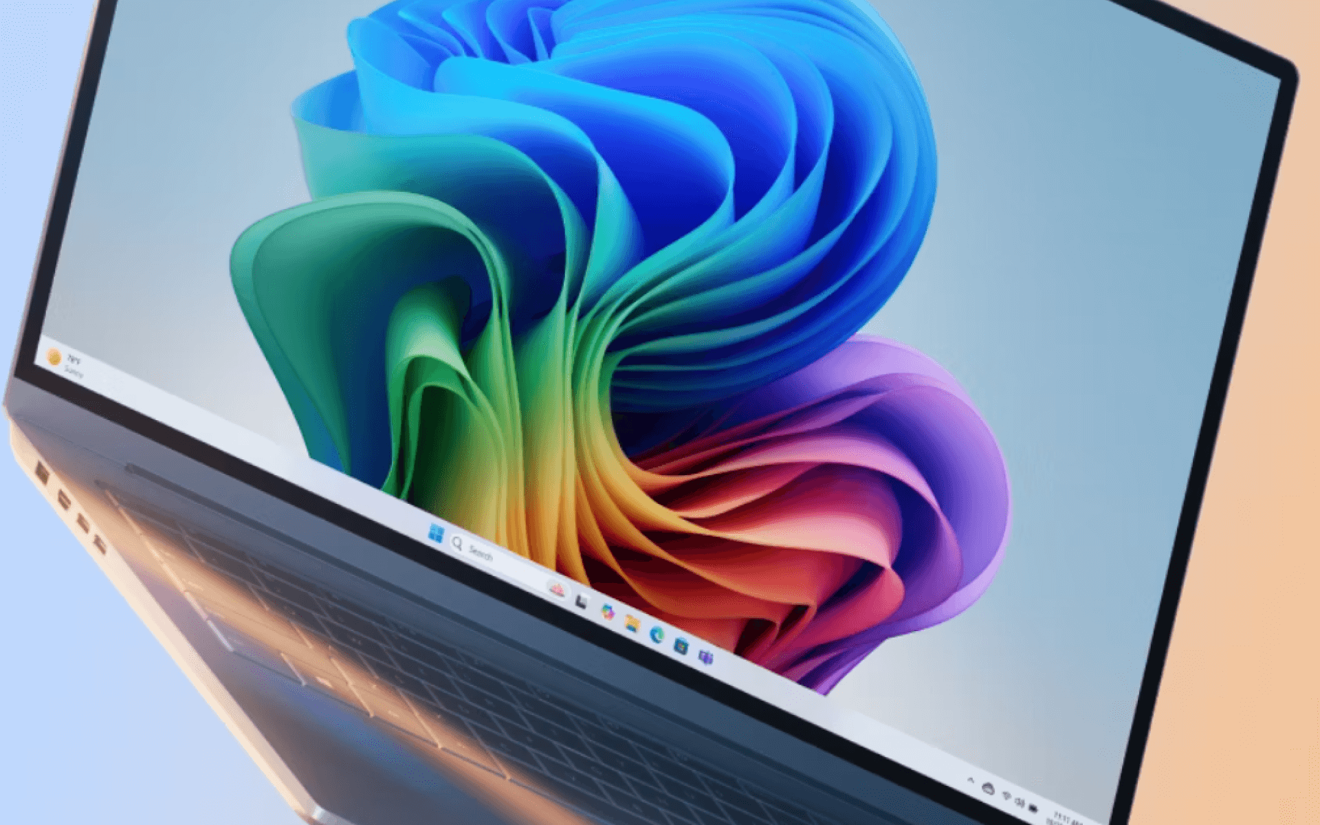 Portátil con fondo de Windows 11